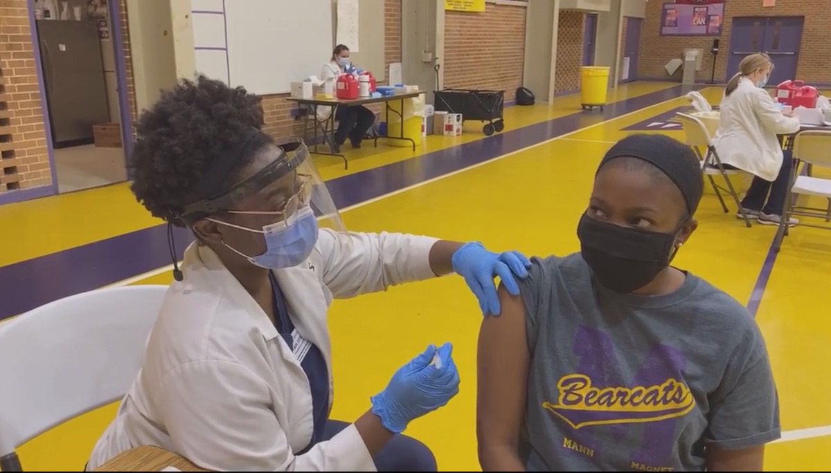 teacher gets covid vaccine